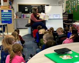 Jennifer Holcomb reads New Oxford Elementary School 1st graders Grandpa and Lucy: A Story about Love and Dementia by written Edie Weinstein (a 9th grader from Minnesota).